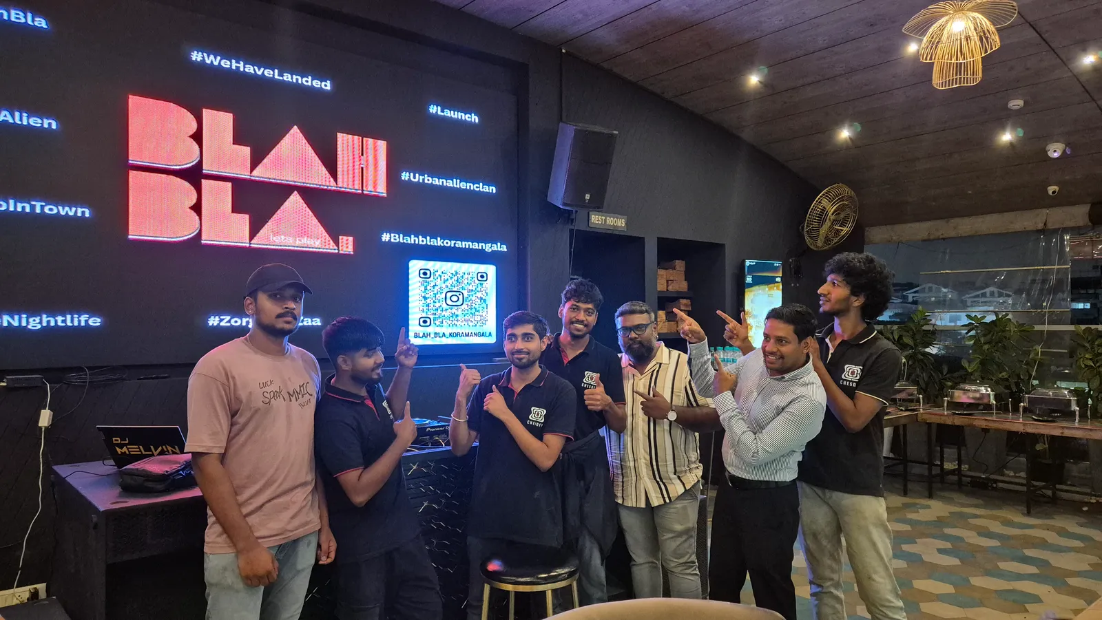 Group gathered in front of an LED wall