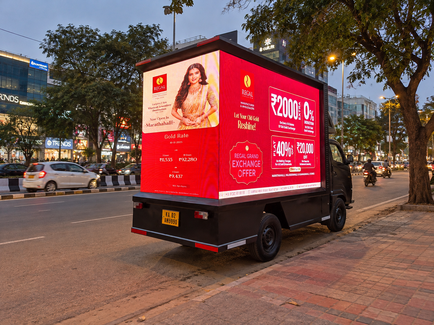 Regal Jewellers advertisement on a mobile LED display truck at dusk